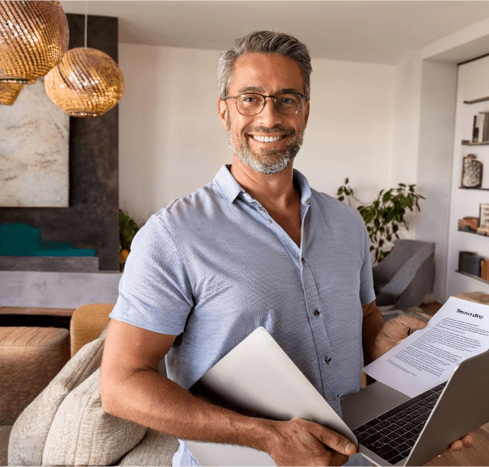 Man smiling with a notebook